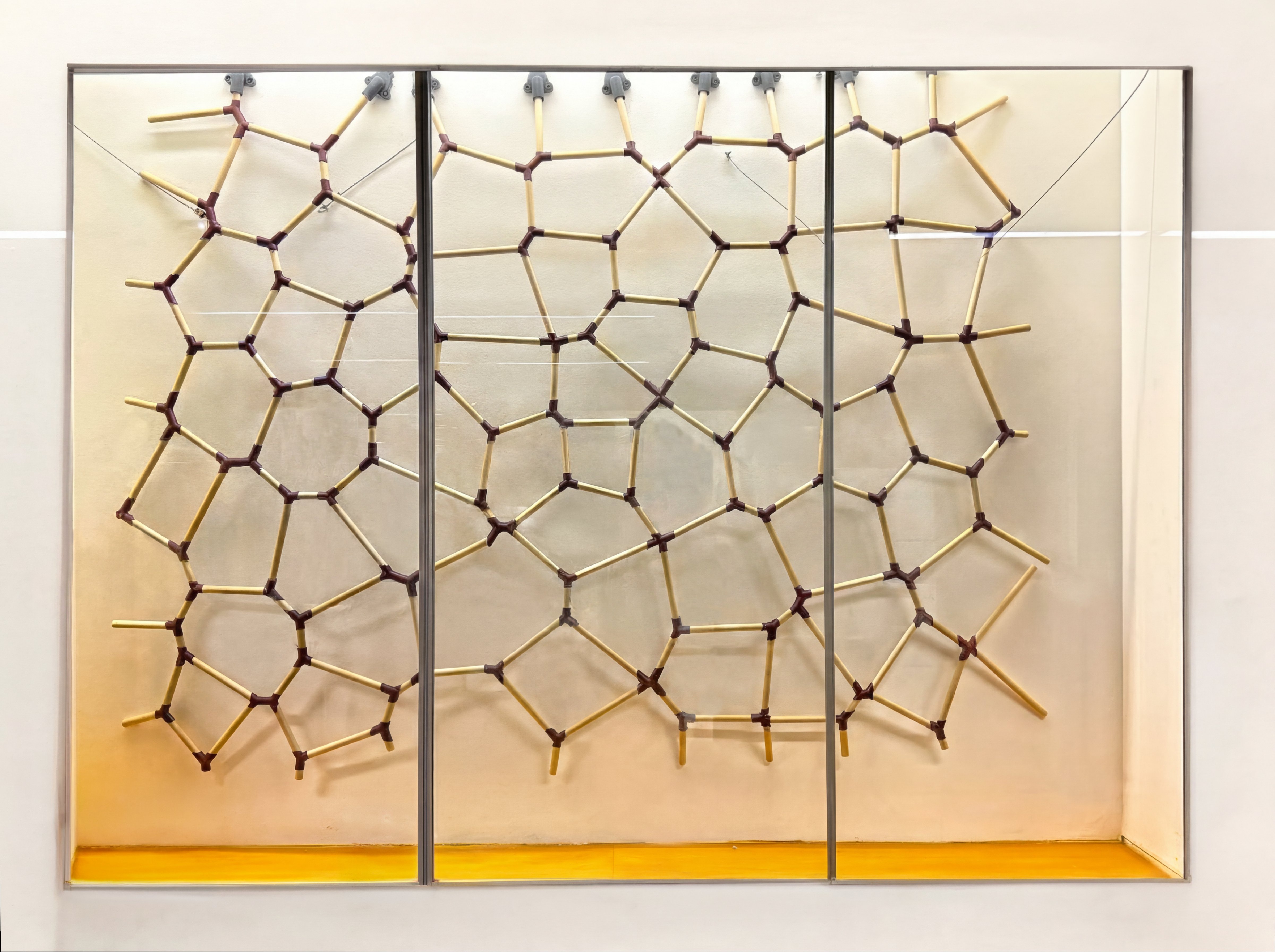 Installed at the gallery · three-panel display